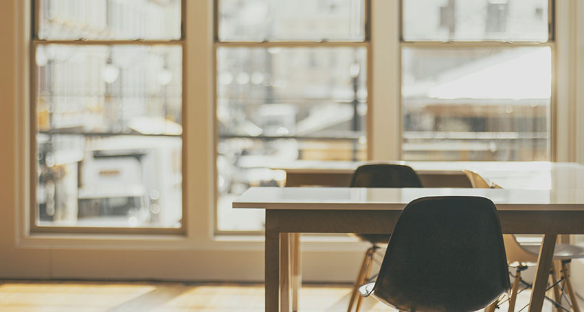 Empty chairs by an empty desk