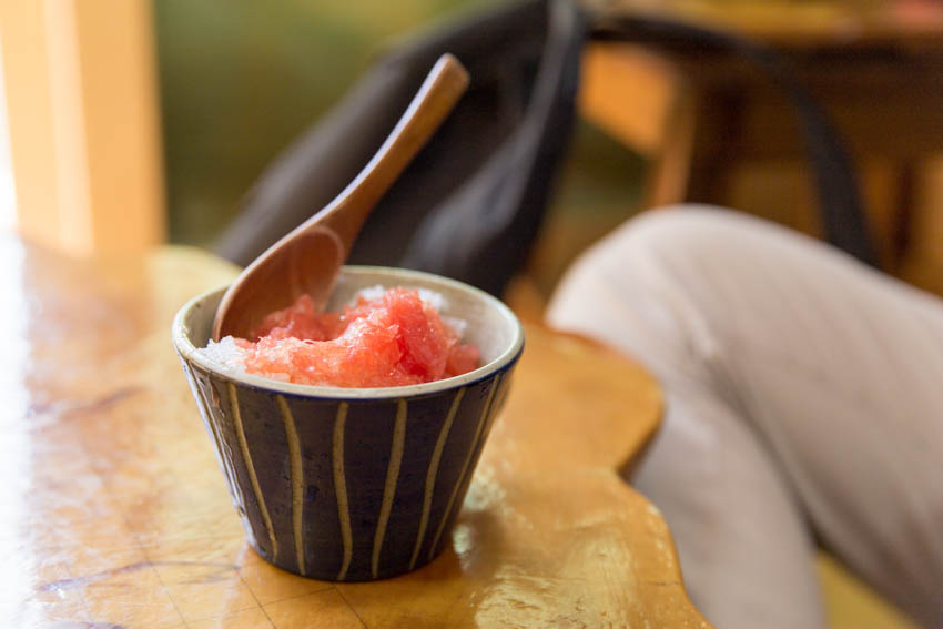 Close up of grapefruit ice tea with visible shaved ice