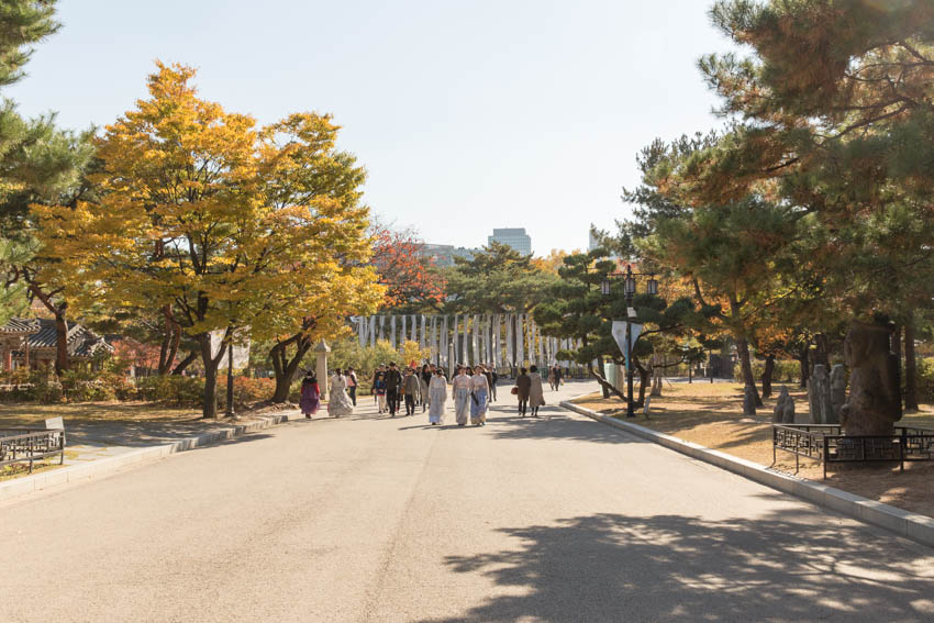 Wide open walkway with people dressed in traditional dress