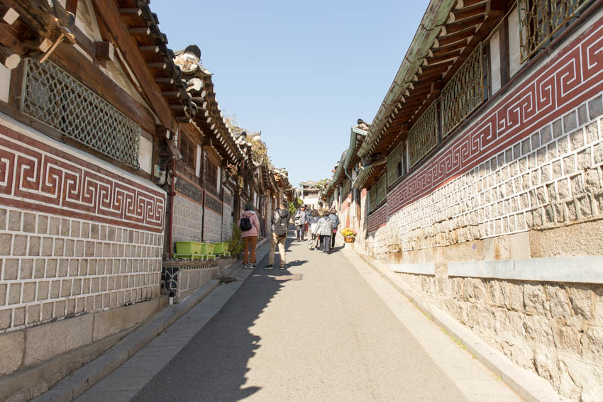 People walking up the hill, a photo taken from the bottom of the hill