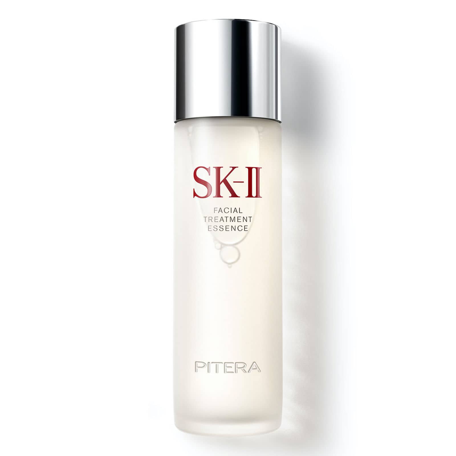 A frosted glass bottle with a silver screw top, reading “SK-II Facial Treatment Essence”