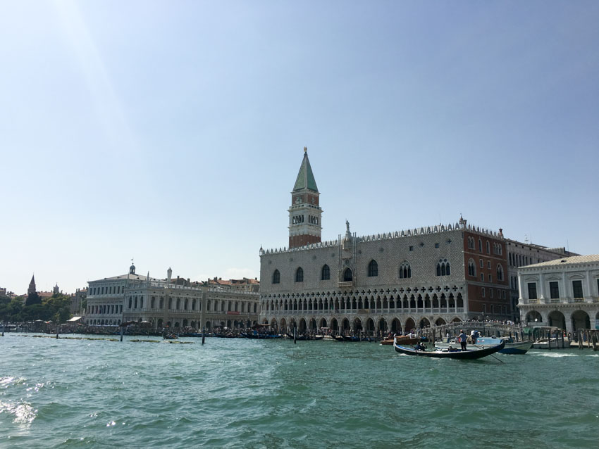 A view of Venice, water in view, taken from a vaporetto (water boat)