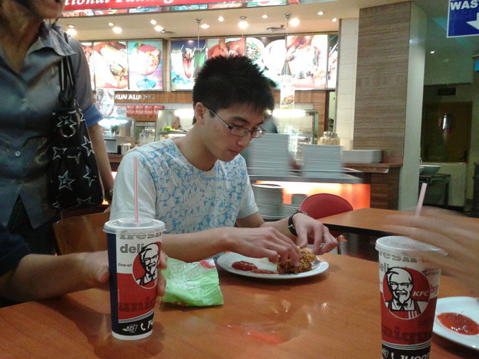 My brother enjoying cheap KFC XD