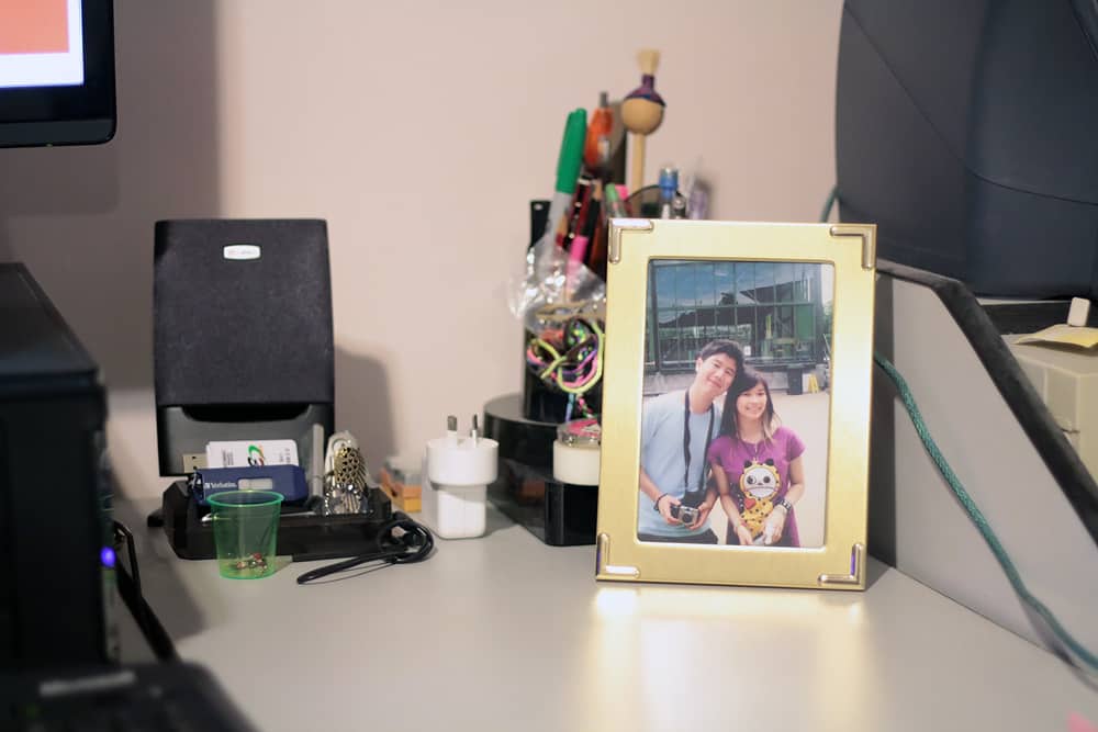 My desk, with a photo of me and James