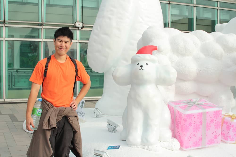 James and a dog statue