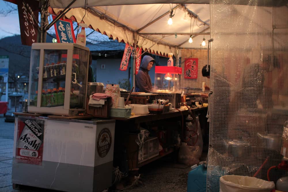 James getting takoyaki (octopus balls)