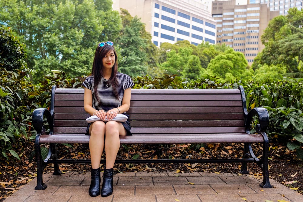 Sitting on a bench.