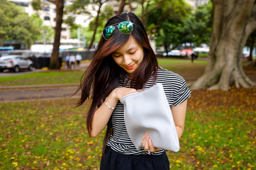 Me in Hyde Park rummaging through my Paloma clutch