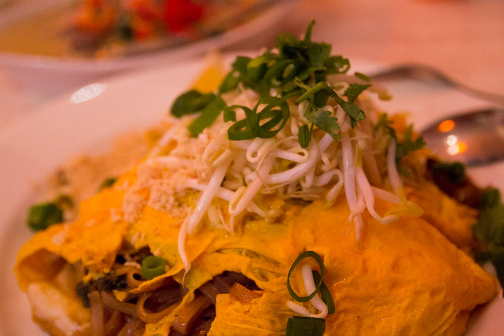 Omelette with stir-fried noodles and vegetables inside