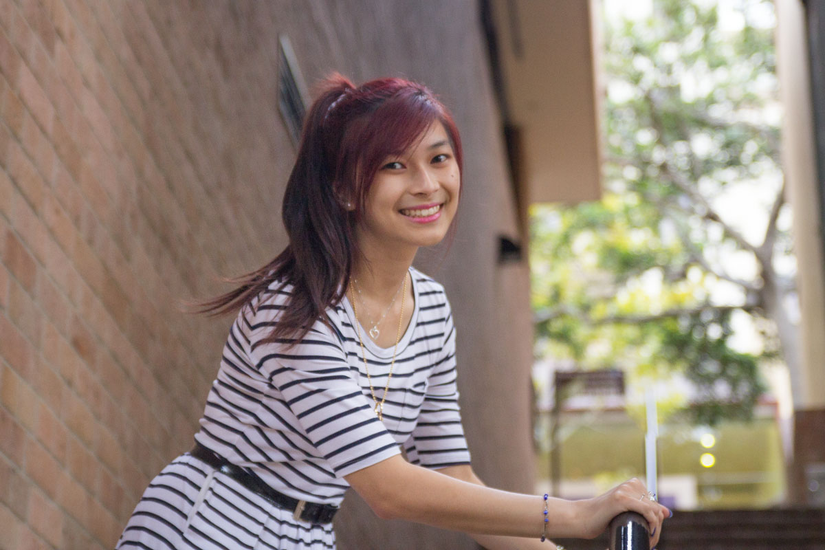 Smiling on the brick set of stairs