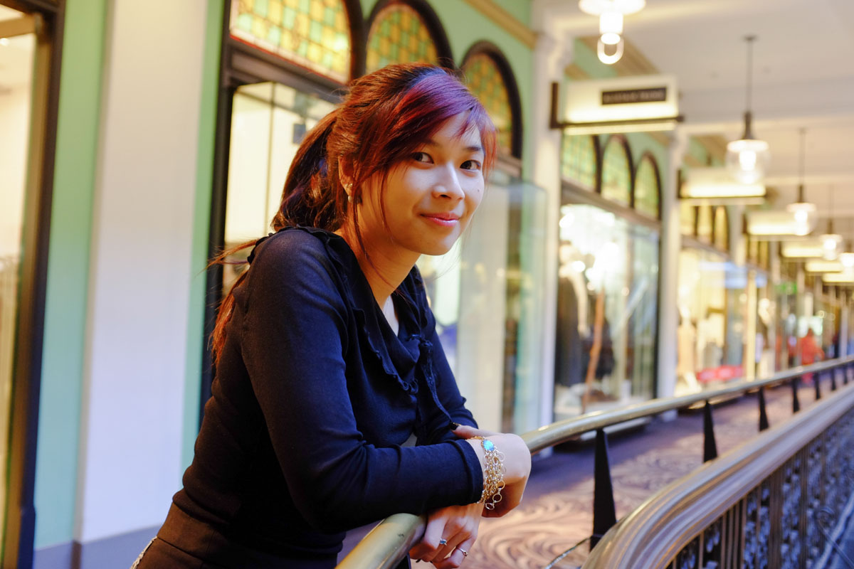 Leaning on the railings in QVB