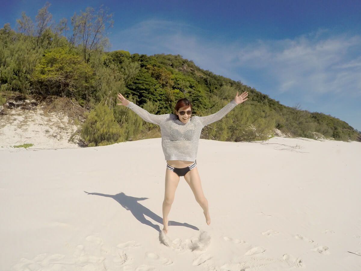 Me doing a star jump in the sand