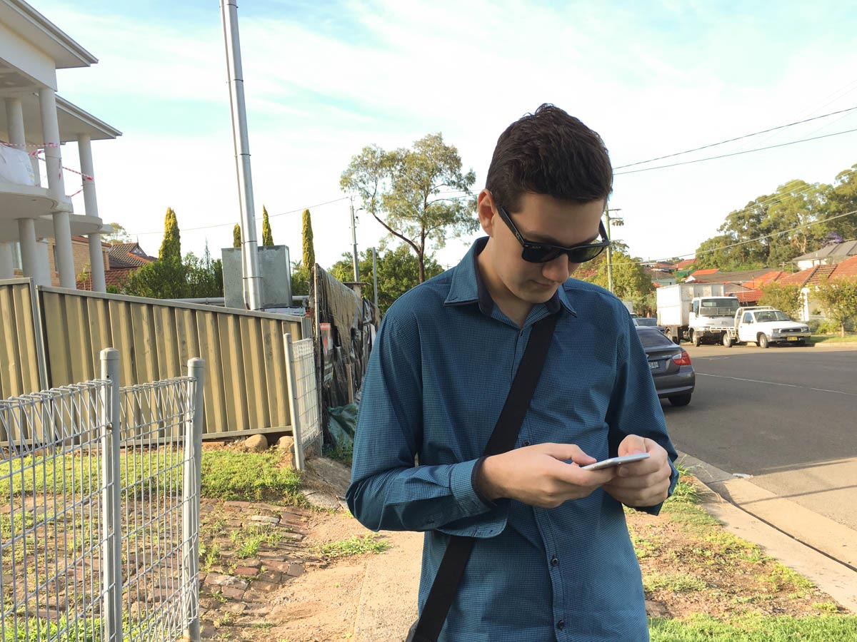 Nick waiting at the bus stop