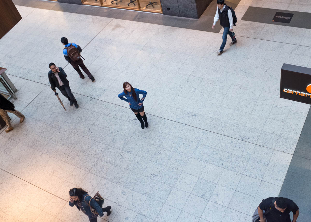 In the centre of the ground floor, among other shoppers