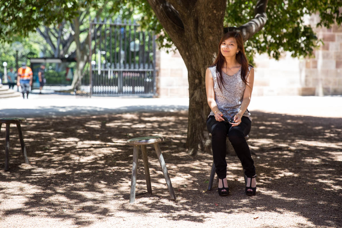 Sitting on a stool under a tree