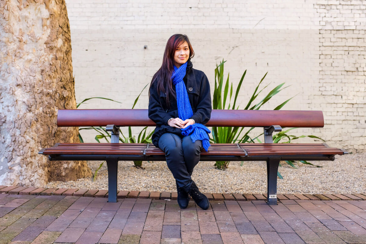 Sitting on a bench in a courtyard