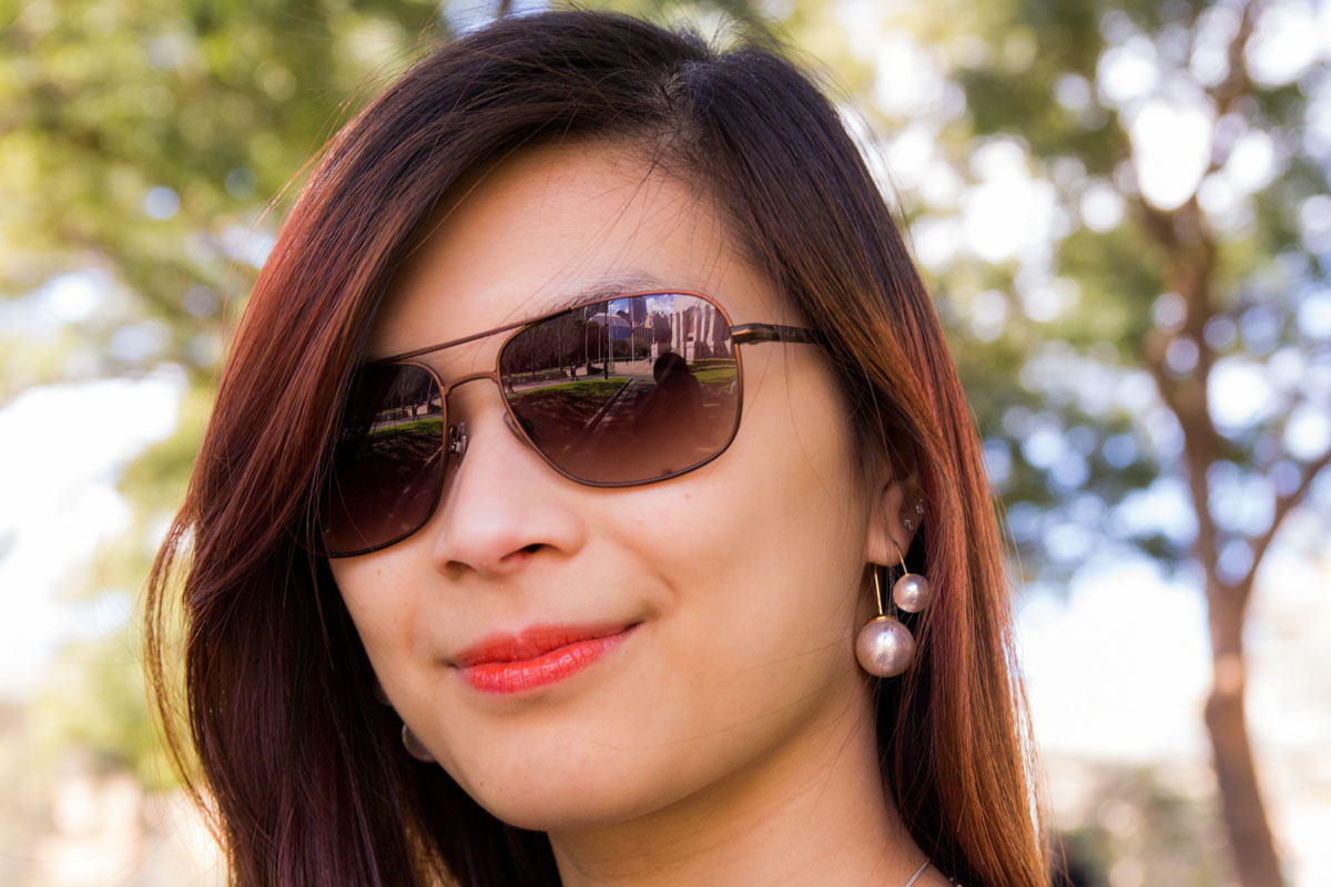 Close up of earrings and sunglasses