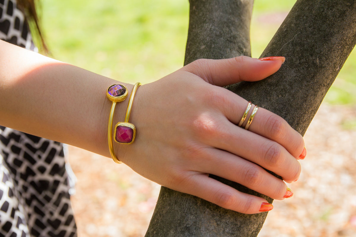 Gold bangle with magenta stone and purple stone