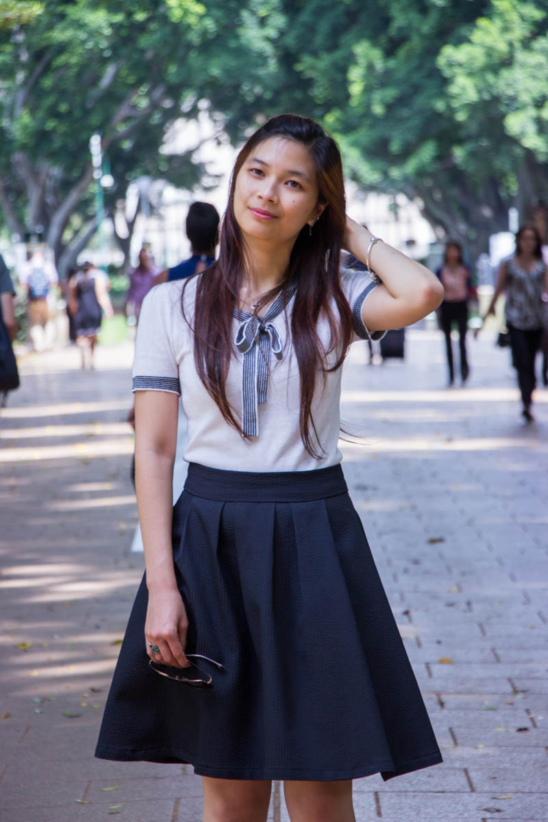 Standing in the middle of the pathway with people in the background