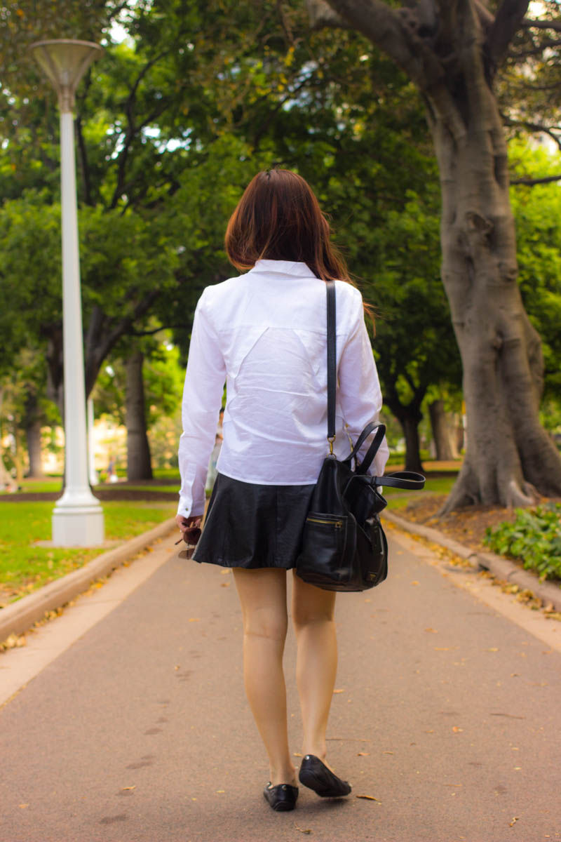 Full body shot from behind, showing shirt detail