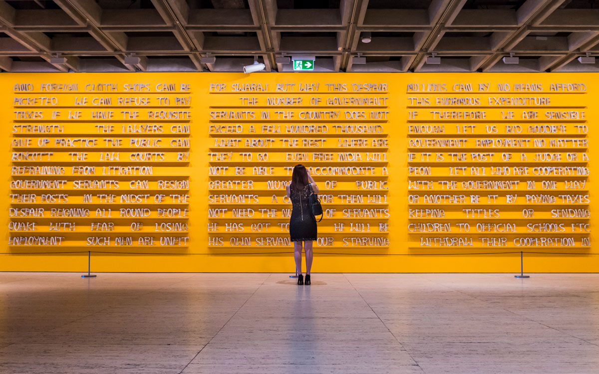 Me standing in front of the artwork ‘Public notice 2’, by Jitish Kallat (2007).