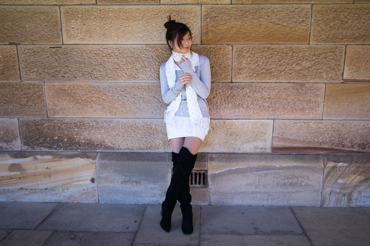 Full body shot against a stone wall