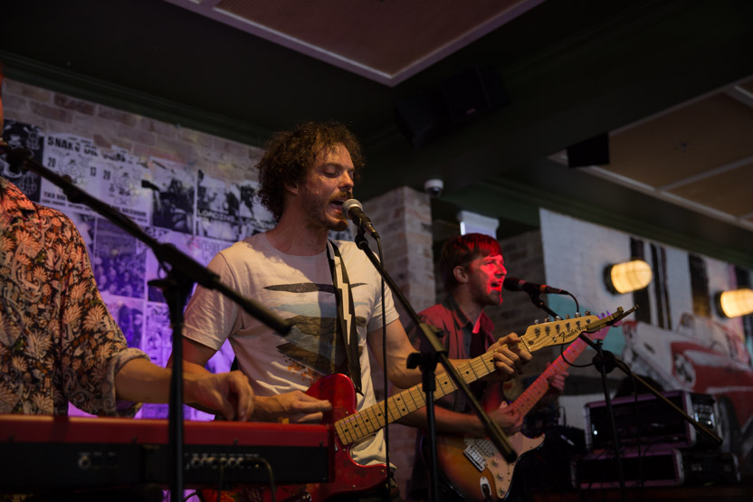 A low angle of the band playing.