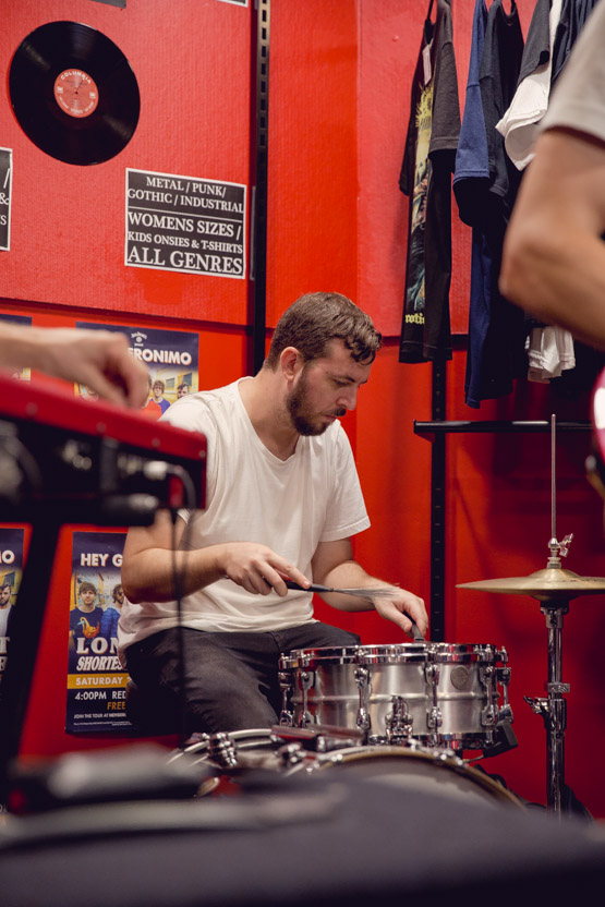 Tony concentrating on playing the drums.