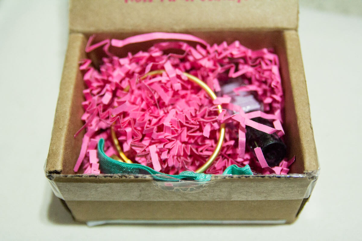 The contents of the box, packed with pink zigzag confetti