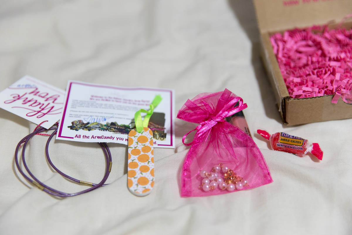 Interlocking bracelet, nail file, hot pink organza bag – the usual stuff