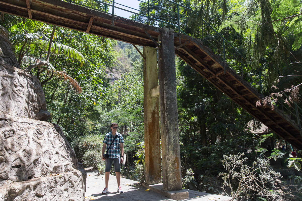 Nick standing under a bridge