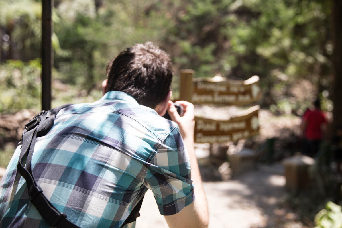 Nick taking a photo of the signpost