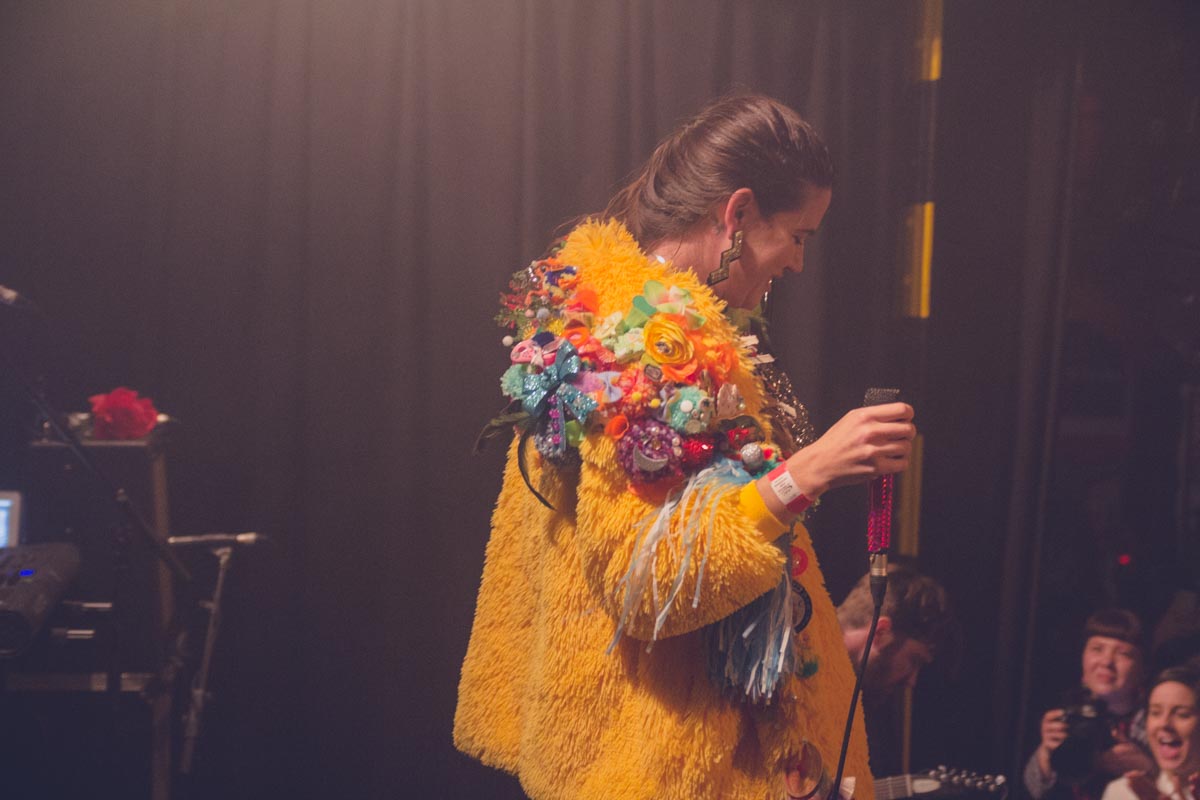 A shot of the back of Patience’s elaborate coat